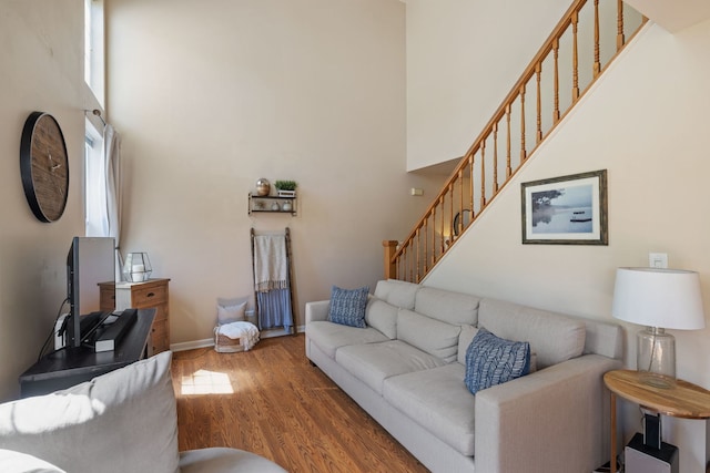 1992 Town Dr, Naperville, IL 60565 - living area with wood finished floors, stairs, a towering ceiling, and baseboards