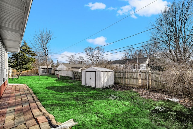 view of yard featuring a storage shed and an outbuilding