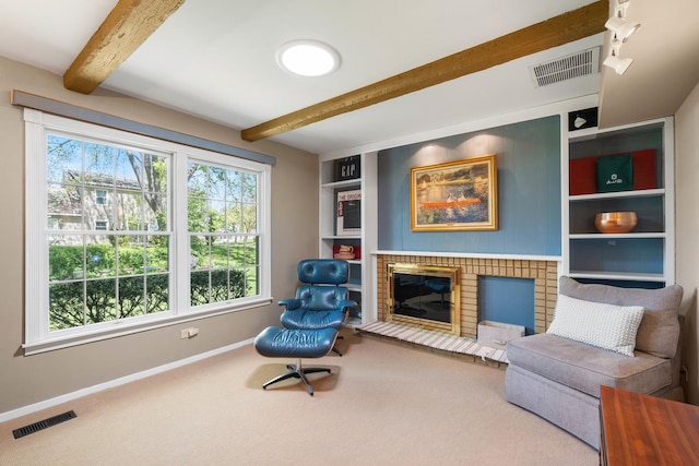 1712 Sutton Ln, Schaumburg, IL 60194 - living area with beamed ceiling, baseboards, carpet, a fireplace, and built in shelves