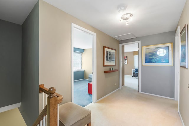 1712 Sutton Ln, Schaumburg, IL 60194 - hall with an upstairs landing, light colored carpet, baseboards, and attic access