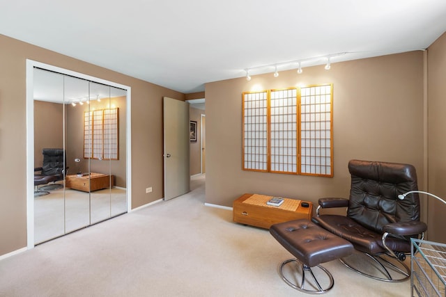 1712 Sutton Ln, Schaumburg, IL 60194 - living area with track lighting, carpet, and baseboards