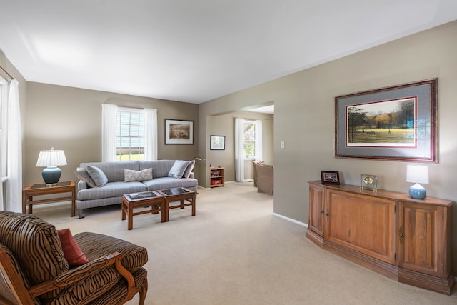 1712 Sutton Ln, Schaumburg, IL 60194 - living room featuring light colored carpet and baseboards