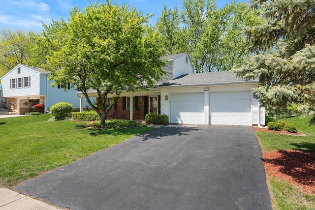 1712 Sutton Ln, Schaumburg, IL 60194 - view of front of home with a garage, driveway, roof with shingles, and a front yard