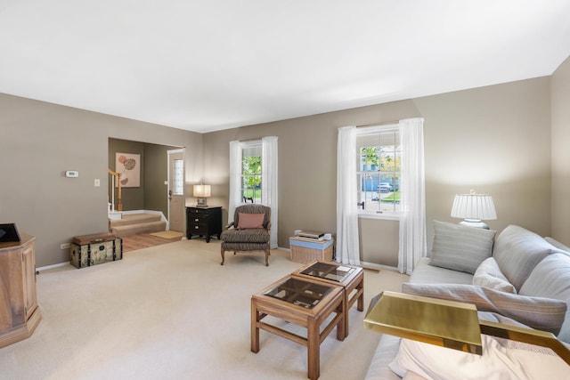 1712 Sutton Ln, Schaumburg, IL 60194 - living room with light carpet and baseboards