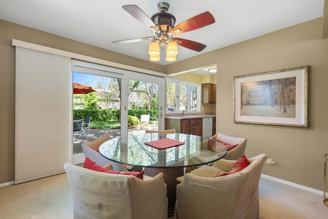 1712 Sutton Ln, Schaumburg, IL 60194 - dining space featuring baseboards, light carpet, and ceiling fan
