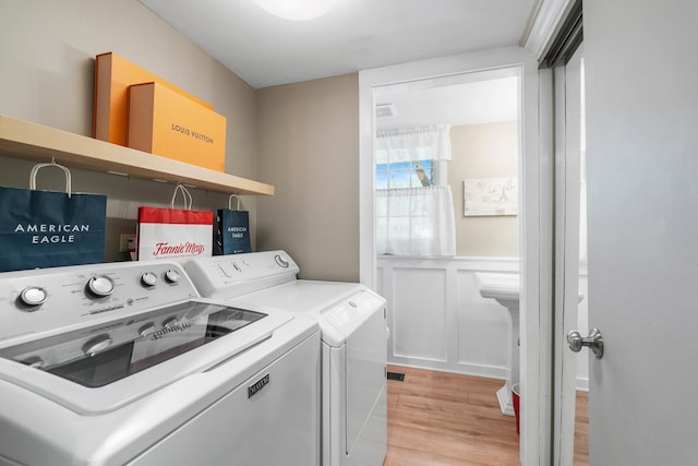 1712 Sutton Ln, Schaumburg, IL 60194 - washroom with light wood-type flooring and washer and dryer