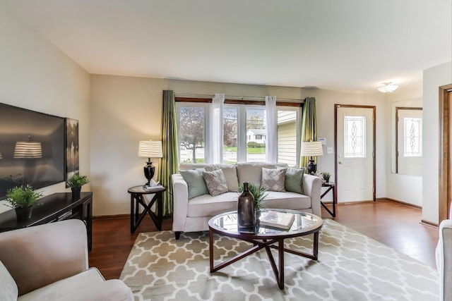 living area featuring wood finished floors and baseboards