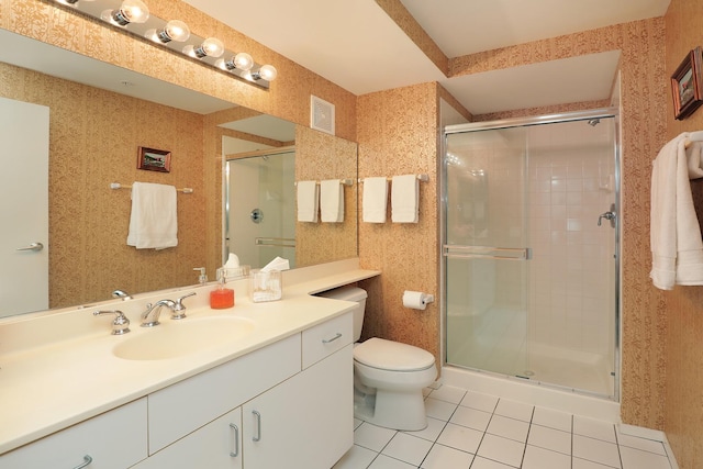 1625 Glenview Rd Unit 210, Glenview, IL 60025 - bathroom with tile patterned floors, toilet, a shower stall, and vanity
