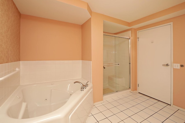 1625 Glenview Rd Unit 210, Glenview, IL 60025 - bathroom featuring a stall shower, a tub with jets, and tile patterned flooring
