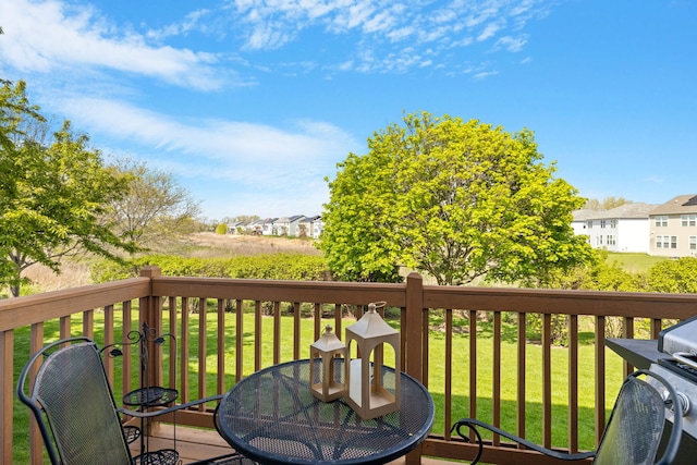 wooden deck with a residential view and a yard