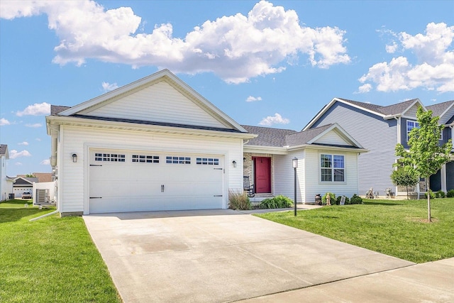 3901 Obsidian Dr, Champaign, IL 61822 - view of front facade featuring a front lawn, concrete driveway, a garage, and ac unit