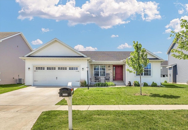 3901 Obsidian Dr, Champaign, IL 61822 - ranch-style home featuring an attached garage, concrete driveway, a front lawn, central AC unit, and a porch