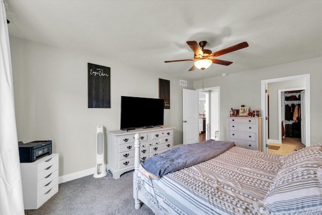 3901 Obsidian Dr, Champaign, IL 61822 - bedroom with baseboards, light carpet, ceiling fan, and a spacious closet