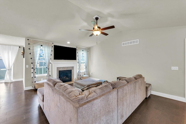 3901 Obsidian Dr, Champaign, IL 61822 - living room featuring ceiling fan, baseboards, dark wood-style floors, lofted ceiling, and a glass covered fireplace