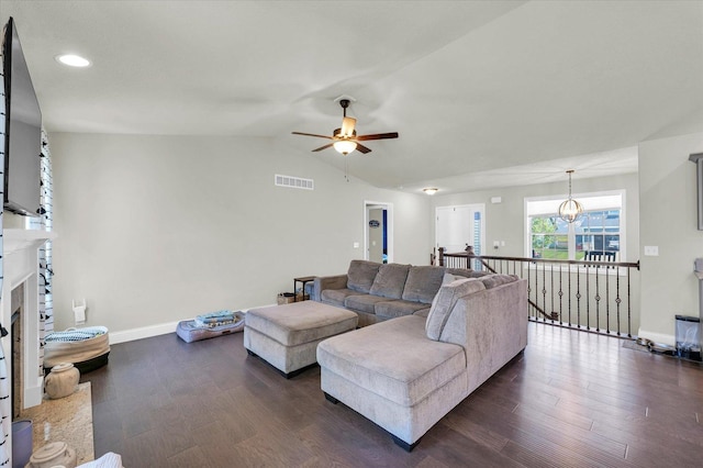 3901 Obsidian Dr, Champaign, IL 61822 - living area featuring a ceiling fan, baseboards, dark wood-style flooring, vaulted ceiling, and a fireplace