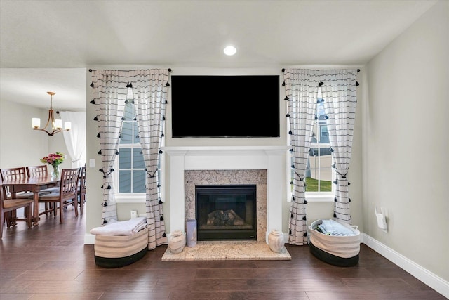 3901 Obsidian Dr, Champaign, IL 61822 - living room featuring a chandelier, baseboards, wood finished floors, a fireplace, and recessed lighting