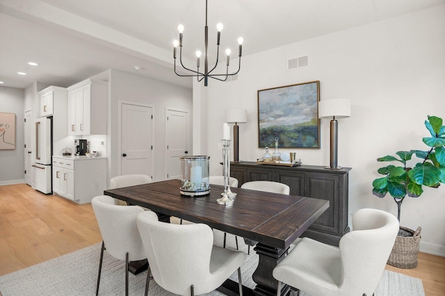 1553 Dempsey Dr, Saint Charles, IL 60174 - dining space featuring light wood-type flooring, a chandelier, recessed lighting, and baseboards