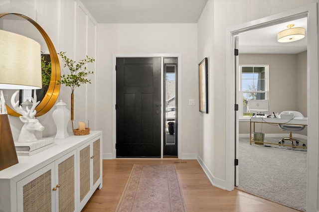 1553 Dempsey Dr, Saint Charles, IL 60174 - entrance foyer with light wood finished floors and baseboards