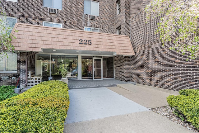225 S Rohlwing Rd Unit 301, Palatine, IL 60074 - property entrance featuring brick siding