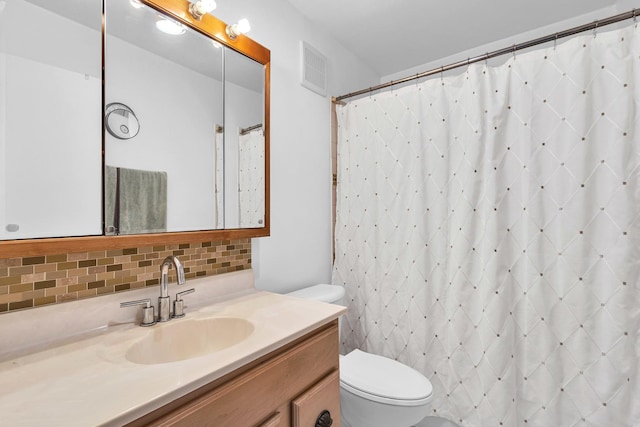 225 S Rohlwing Rd Unit 301, Palatine, IL 60074 - full bathroom with toilet, decorative backsplash, vanity, and a shower with curtain