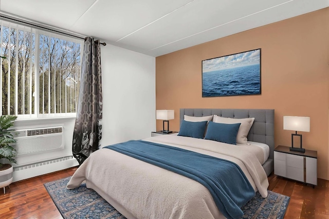 225 S Rohlwing Rd Unit 301, Palatine, IL 60074 - bedroom with baseboard heating, wood finished floors, and a wall mounted AC
