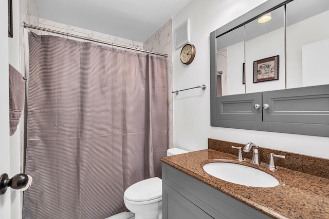 225 S Rohlwing Rd Unit 301, Palatine, IL 60074 - bathroom featuring toilet, vanity, and a shower with shower curtain