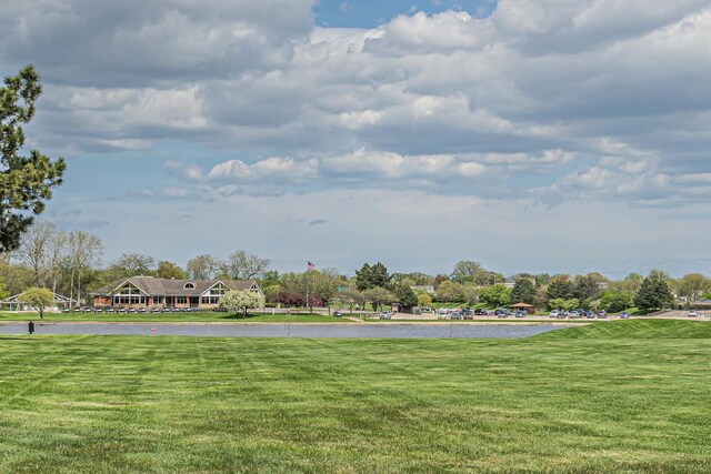 225 S Rohlwing Rd Unit 301, Palatine, IL 60074 - surrounding community with a yard and a water view
