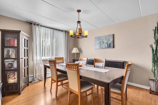 225 S Rohlwing Rd Unit 301, Palatine, IL 60074 - dining area with a chandelier, light wood-type flooring, baseboards, and baseboard heating