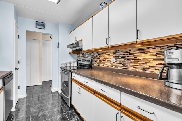 225 S Rohlwing Rd Unit 301, Palatine, IL 60074 - kitchen with appliances with stainless steel finishes, under cabinet range hood, dark countertops, and backsplash
