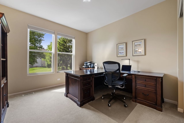 carpeted office featuring baseboards