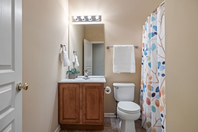 bathroom with toilet, vanity, a shower with shower curtain, and tile patterned floors