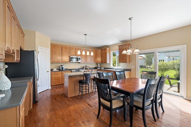 dining room featuring a chandelier and wood finished floors