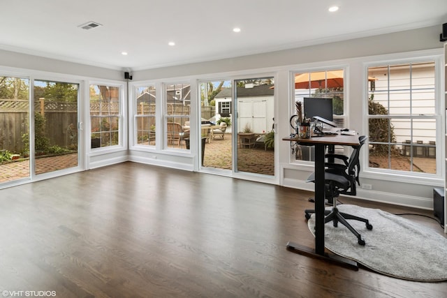 office area with healthy amount of natural light, recessed lighting, wood finished floors, and crown molding
