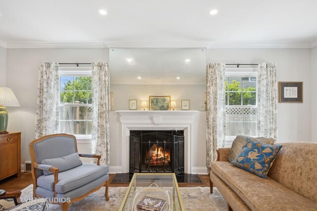 843 Chilton Ln, Wilmette, IL 60091 - living area featuring crown molding, healthy amount of natural light, recessed lighting, a fireplace with flush hearth, and wood finished floors