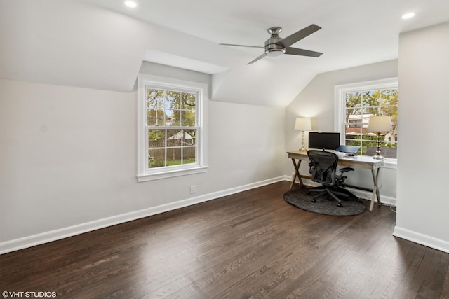 home office with ceiling fan, lofted ceiling, plenty of natural light, wood finished floors, and baseboards
