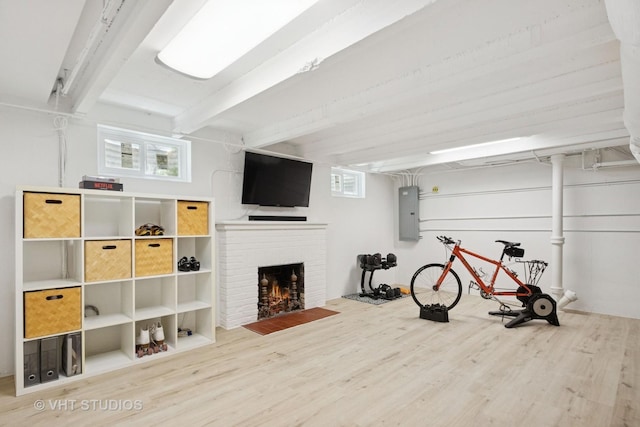 843 Chilton Ln, Wilmette, IL 60091 - exercise area with wood finished floors, electric panel, and a brick fireplace