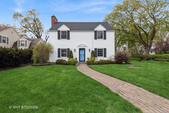 843 Chilton Ln, Wilmette, IL 60091 - view of front of property featuring a chimney and a front yard