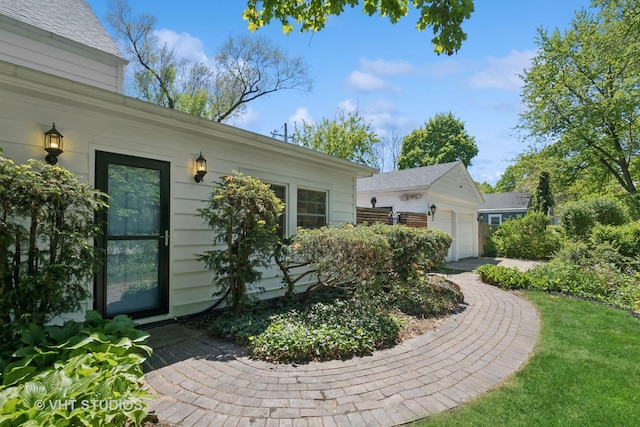 843 Chilton Ln, Wilmette, IL 60091 - view of home's exterior with a garage and an outdoor structure