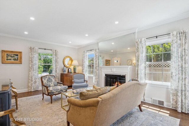 843 Chilton Ln, Wilmette, IL 60091 - living room with a lit fireplace, baseboards, wood finished floors, recessed lighting, and crown molding