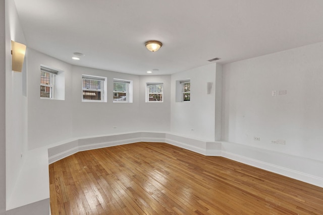 empty room featuring light wood-style flooring and baseboards