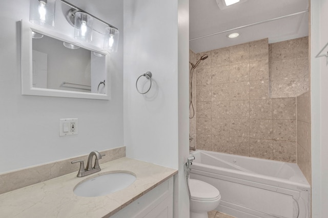 bathroom featuring toilet, shower / tub combination, and vanity