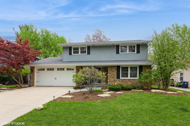 traditional home featuring an attached garage, a front yard, concrete driveway, and brick siding