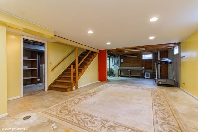 basement featuring stairway, recessed lighting, and baseboards
