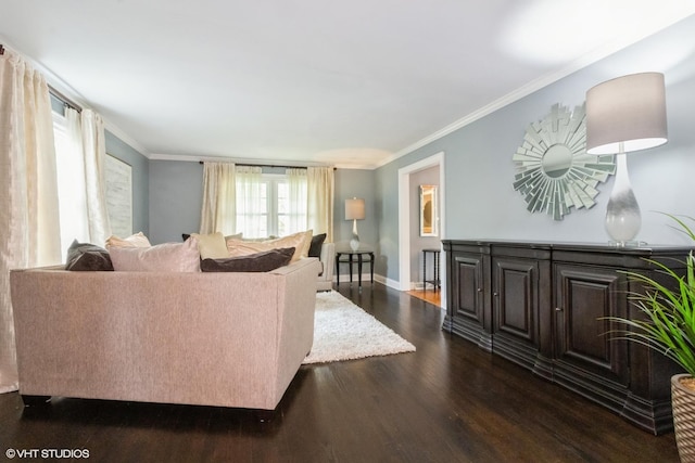 living room with dark wood-style floors, ornamental molding, and baseboards