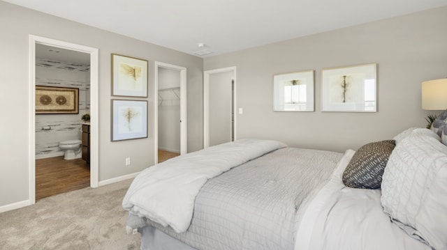 14739 Hillside Dr S, Lockport, IL 60441 - bedroom with a walk in closet, light carpet, baseboards, a closet, and ensuite bath