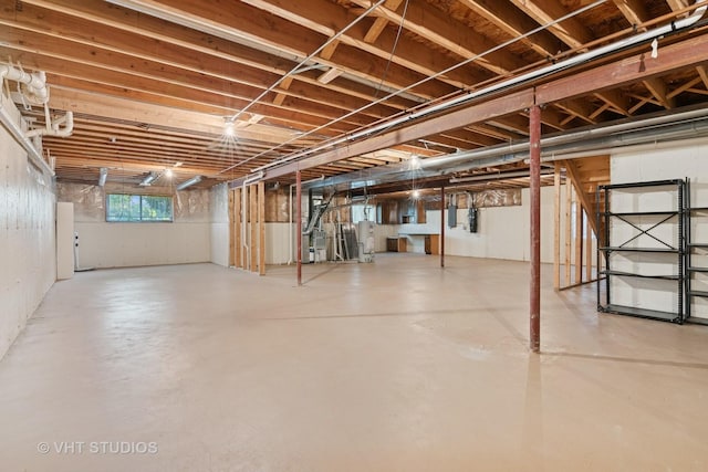 below grade area featuring water heater