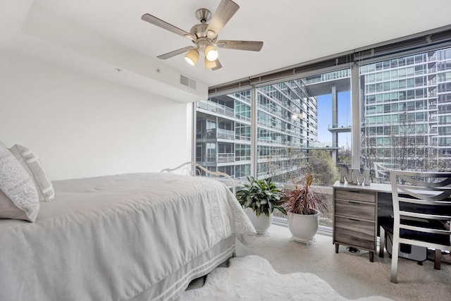 9725 Woods Dr Unit 507, Skokie, IL 60077 - bedroom featuring carpet floors, a ceiling fan, and expansive windows