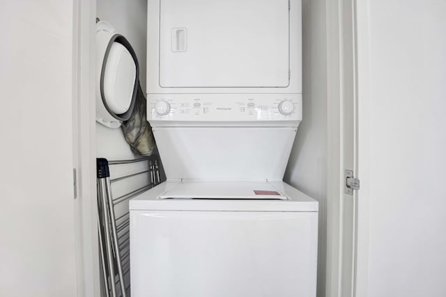 9725 Woods Dr Unit 507, Skokie, IL 60077 - clothes washing area featuring stacked washer and clothes dryer