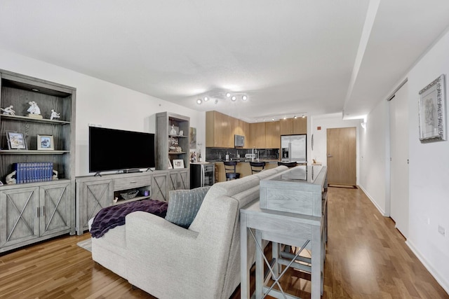 9725 Woods Dr Unit 507, Skokie, IL 60077 - living room featuring light wood-style floors and baseboards