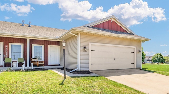 view of front of house with covered porch, a front yard, roof with shingles, concrete driveway, and an attached garage